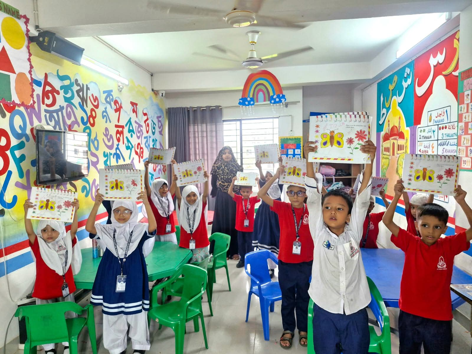 Students displaying their artwork during an art and craft activity at Al Ehsan Academy in a colorful and engaging classroom environment.